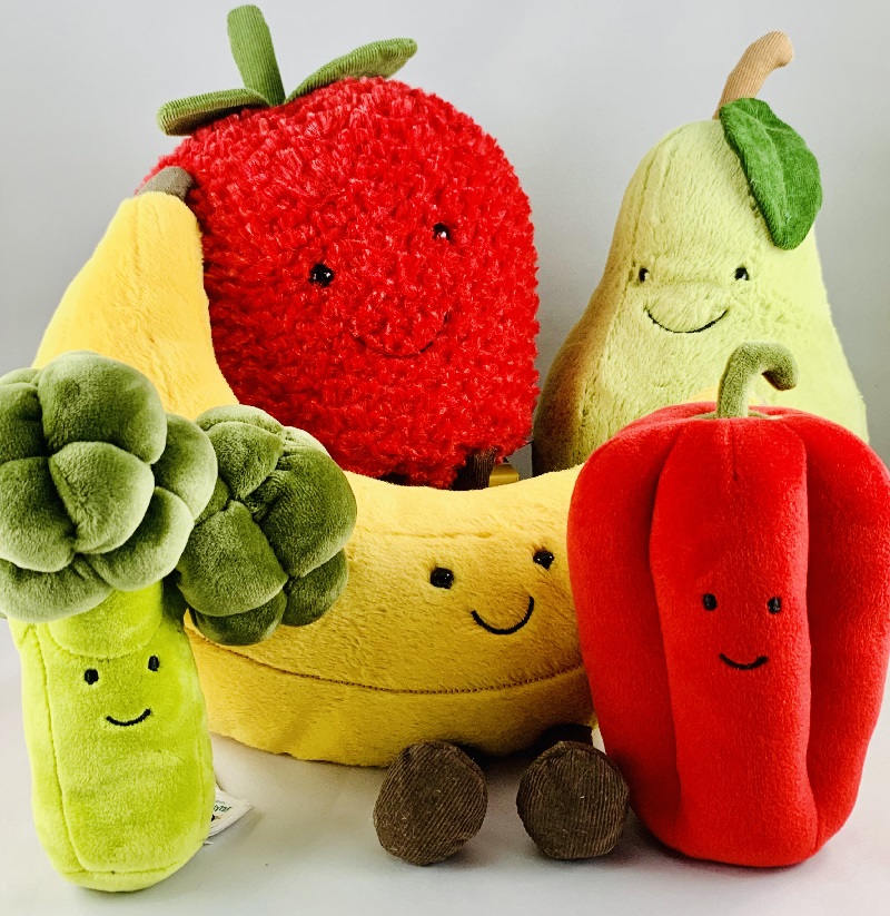 Children's gifts. Image of a jellycat soft toys banana strawberry broccoli red pepper pear.